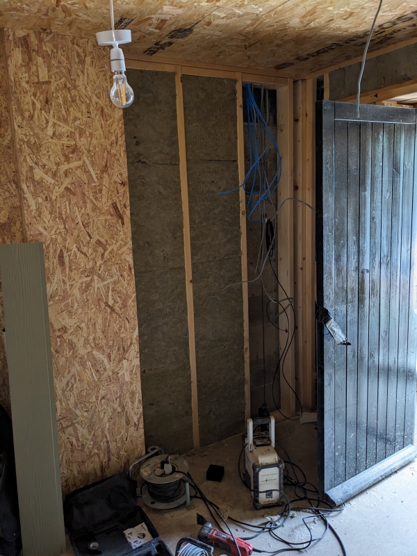 Interior view showing insulation and wiring.